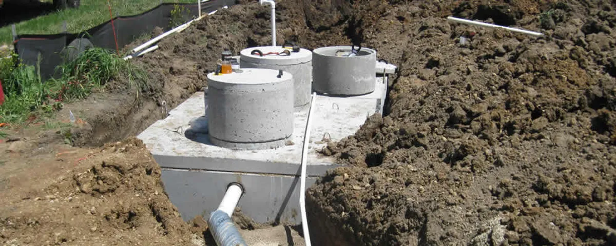 Septic system repair and installation site with tank access ports in Staten Island, NY