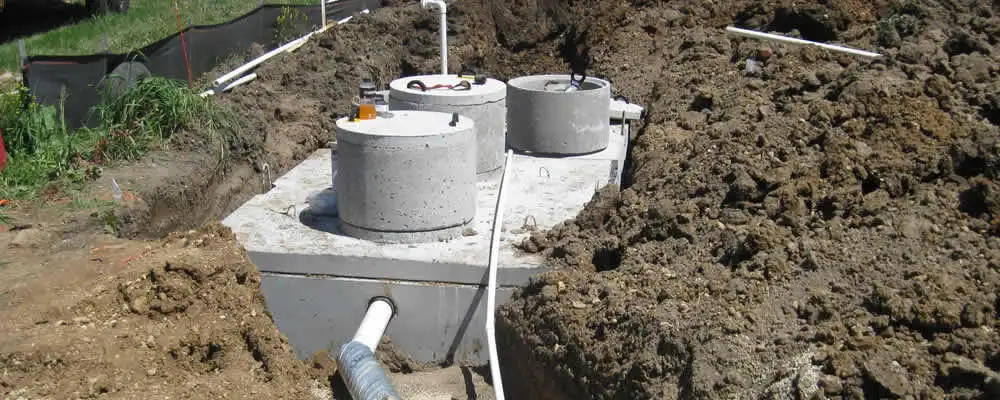 Septic system repair and installation site with tank access ports in Staten Island, NY